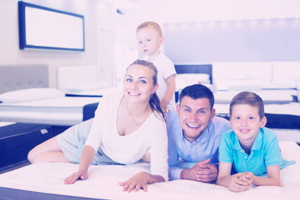 istock Family choosing mattress in store 830187902