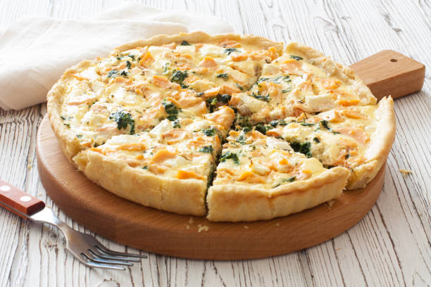 Pie ( quice) with salmon, spinach and soft cheese stock photo