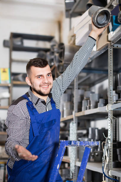 istock Male worker looking through sanitary drain pipes 830192942