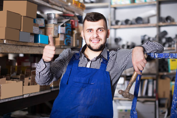 istock Worker demonstrates a neat warehouse for parts 830193188