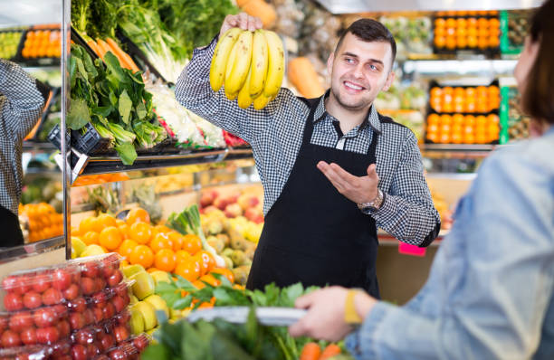istock Male seller assisting in buying 830193388
