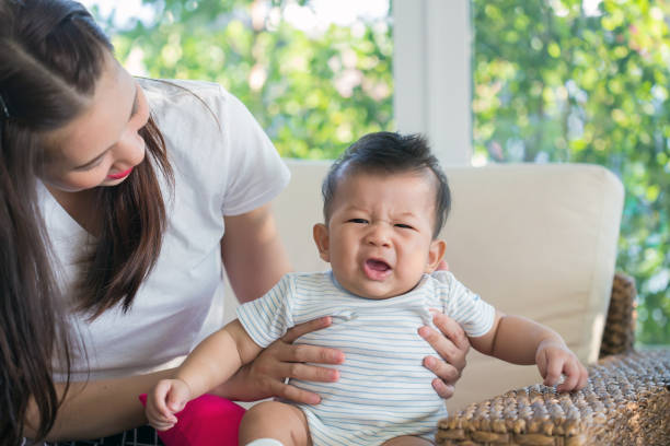 istock Mother comforting crying newborn baby 830201838