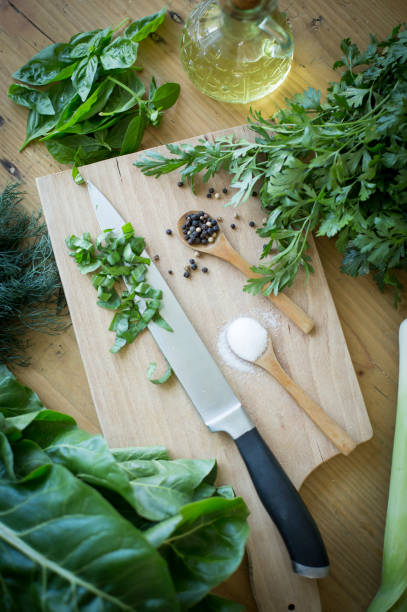 Culinary border of herbs and spices shot from above on kitchen countertop. Copy space