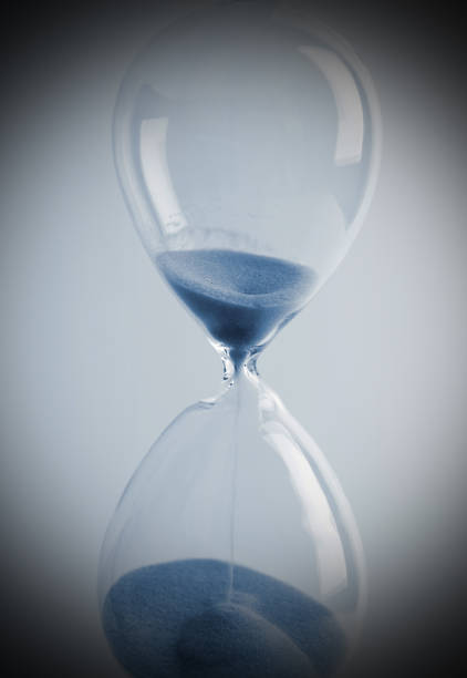 istock Close up of hourglass blue toned 830217266