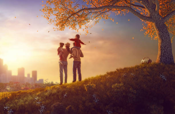 Happy family at sunset