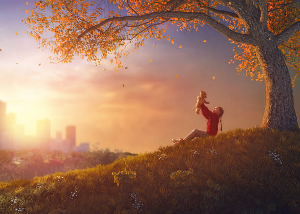 istock girl walking in autumn park 830231792