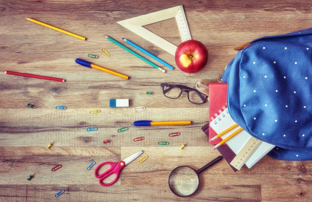 istock Wooden desk with supplies 830256392