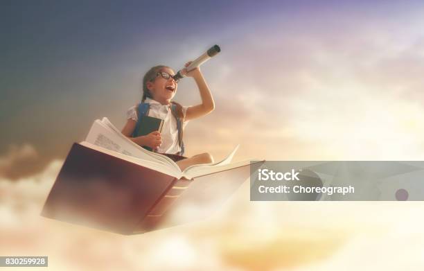 Child Flying On The Book Stock Photo - Download Image Now - Child, Book, Reading