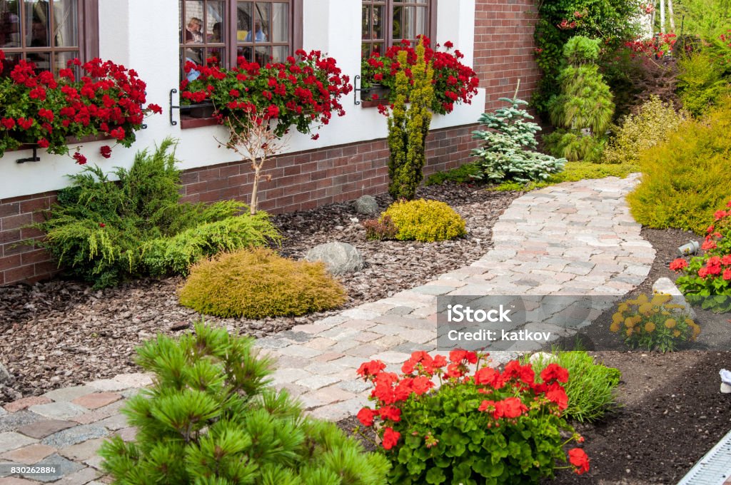 Beautiful flower garden House with a beautiful garden on a sunny day Nursing Home Stock Photo