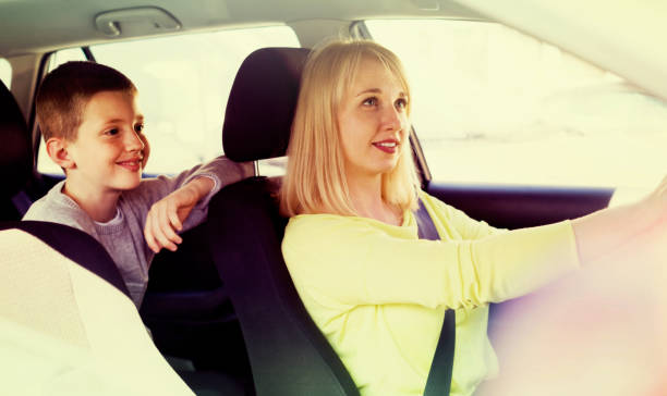 istock mother and son taking car ride during sightseeing tour 830270152