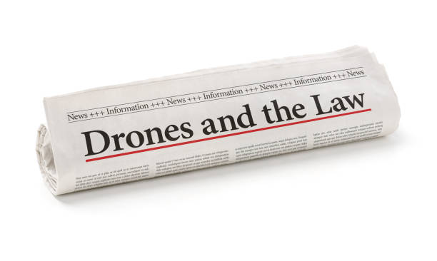 istock Rolled newspaper with the headline Drones and the Law 830273608