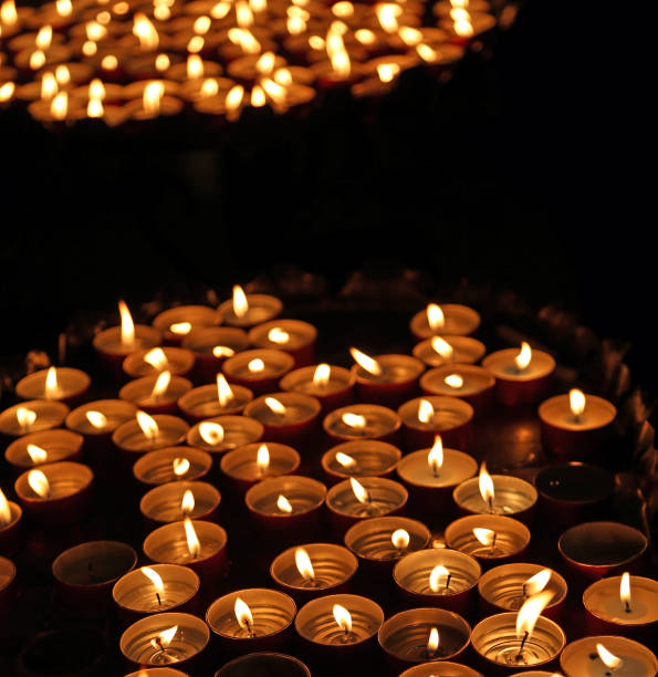 istock candles lit with the warm flame during the religious ceremony 830277348