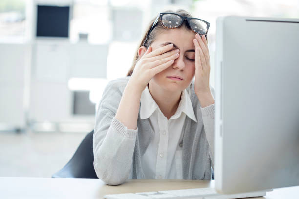 istock Tired woman touching her eyes 830293590