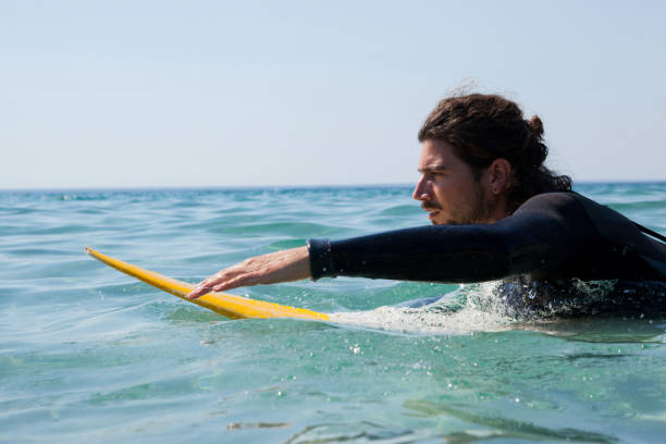 istock Surfer surfboarding in the sea 830297804