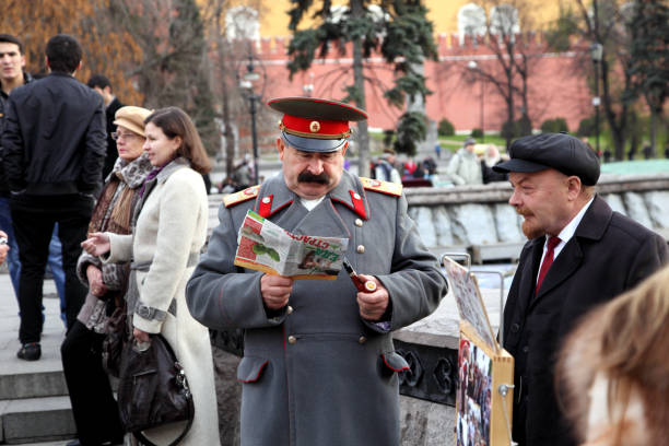 Moscow, Russia - November 4, 2011: Actors depicting Stalin and Lenin, waiting for tourists who can be photographed with them for money. Stalin and Lenin were rulers of the USSR in the early 20th century.