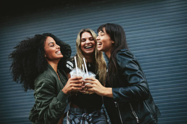 istock Smiling young women with ice coffee 830320920