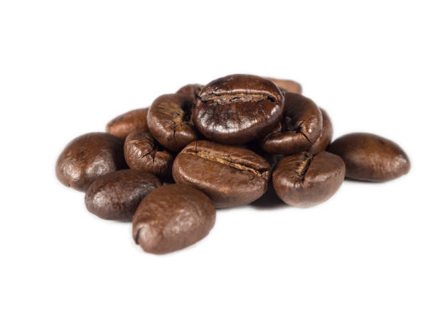 istock Roasted coffee grains on white isolated background from close up view 830322398