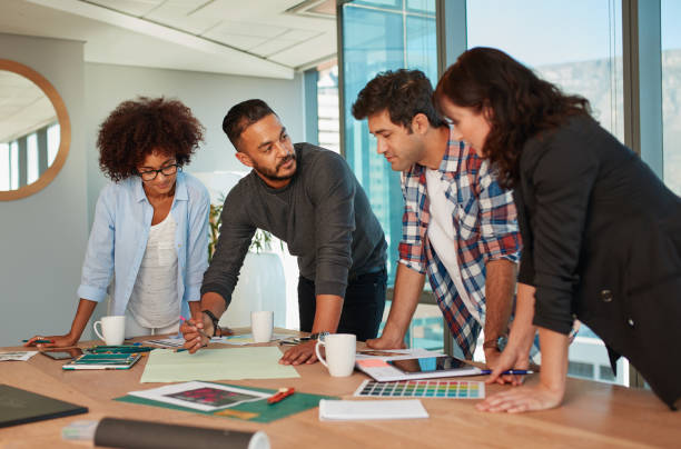 istock Creative professionals having a meeting in boardroom 830322698