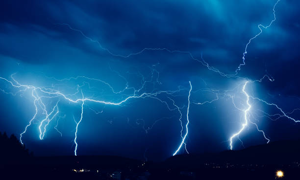 dangerous power of nature thunderbolt lightning in stormy night, nature power abstract background. lightning storm natural disaster cloud stock pictures, royalty-free photos & images