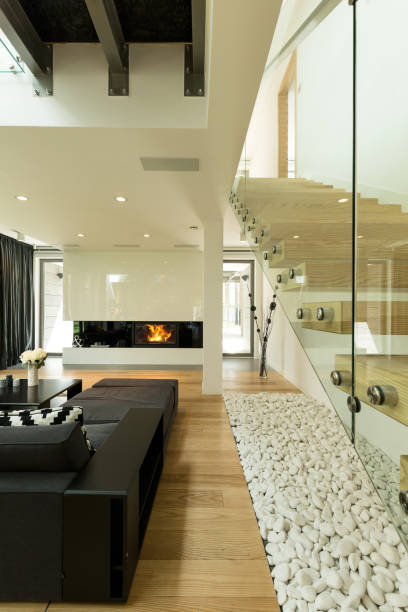 istock Modern living room with a couch and fireplace 830346018
