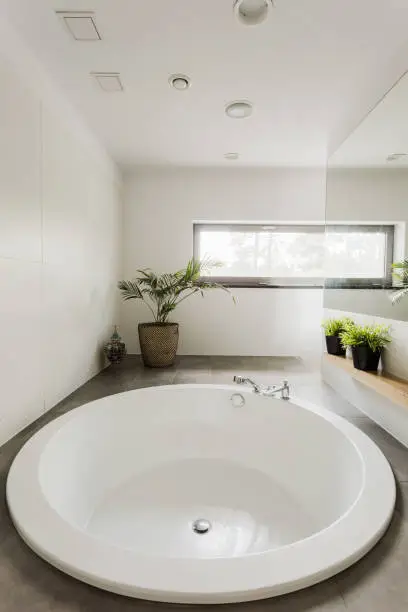 Photo of Modern bathroom with  round bathtub