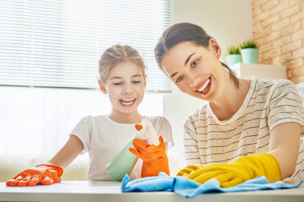 istock family cleans the room 830350734