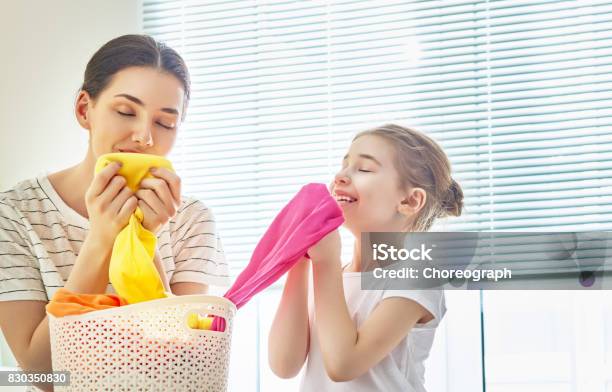 Family Doing Laundry At Home Stock Photo - Download Image Now - Clothing, Smelling, Laundry