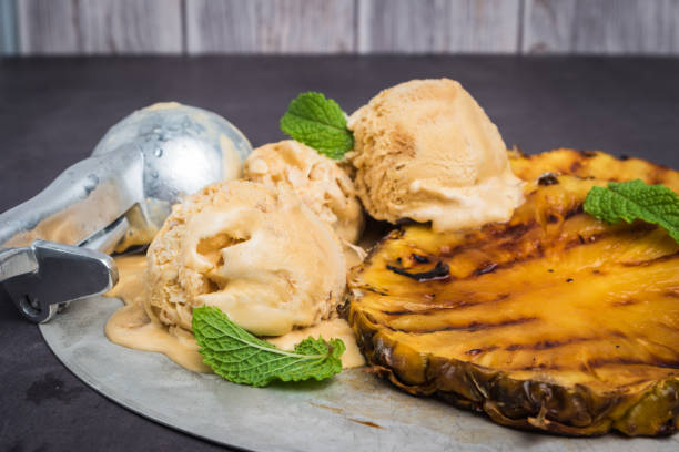 istock Grilled pineapple with vanilla ice cream and mint leaves 830361626