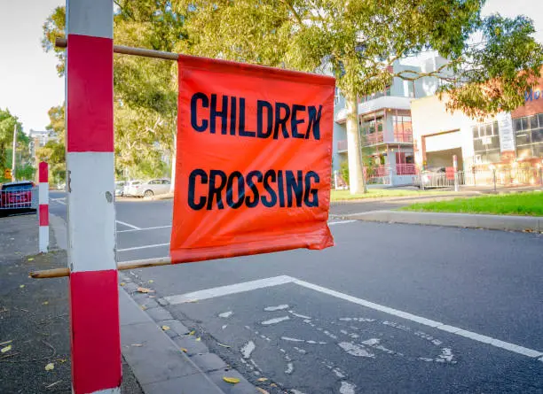 An Australian "Children Crossing" signpost outside a school in Melbourne Australia