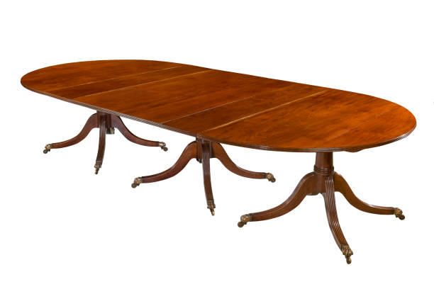 istock Dining table fully extended isolated old antique mahogany wood 830365840