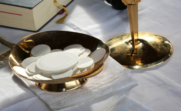 istock consecrated Host during the Mass of first communion 830373838