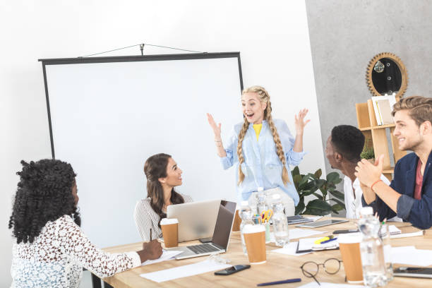 istock multicultural group of business people discussing work in office 830385186