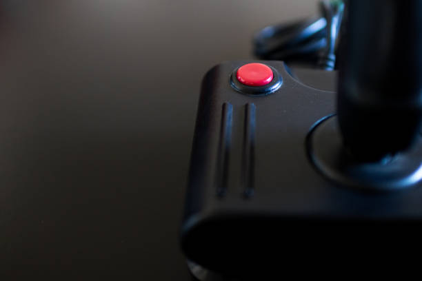 istock close up to a red button of a joystick 830388880