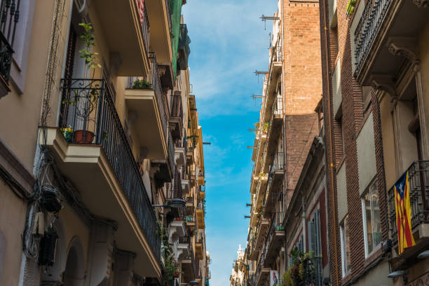istock spanish alley with flags on balcony 830391342