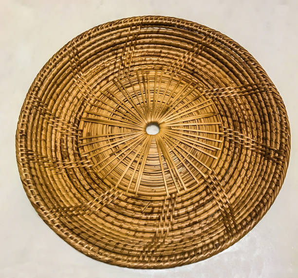 istock Empty bamboo rattan woven tray place mat on the white marble table background 830391640