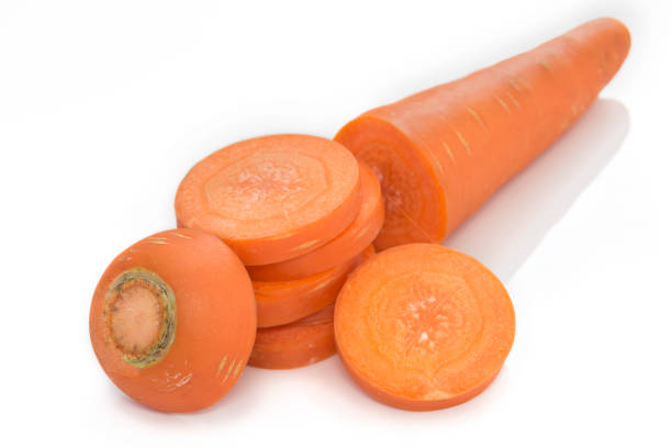 istock carrot slices isolated on white background. 830400248