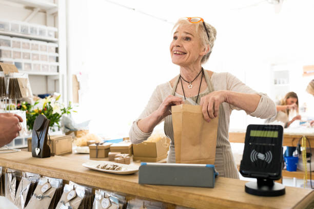 istock Senior woman making a sale in her workshop 830407076
