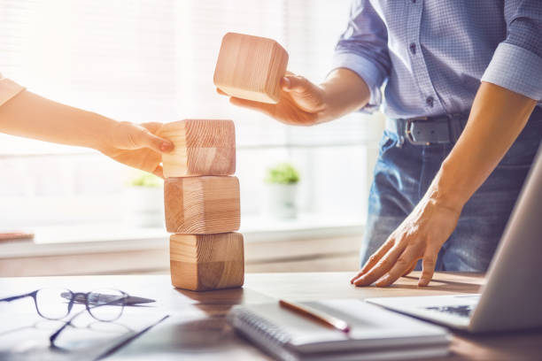 istock man and woman working in the office 830412930