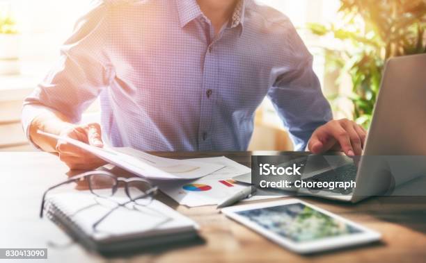 Man Working In Office Stock Photo - Download Image Now - Finance, Proofreading, Desk