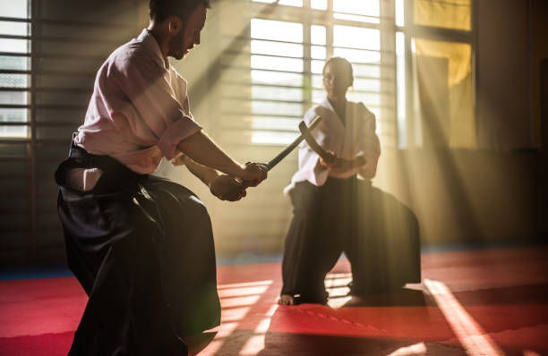 Two Aikido Fighters With Bokken Swords