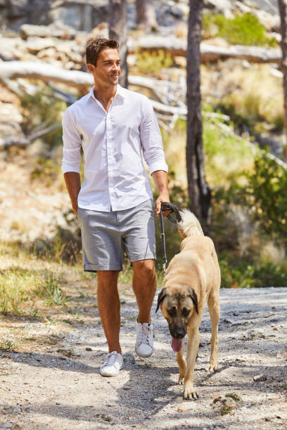istock Casual guy with pet dog 830427842