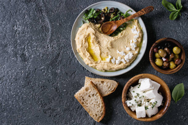 istock Hummus with olives and herbs 830429698
