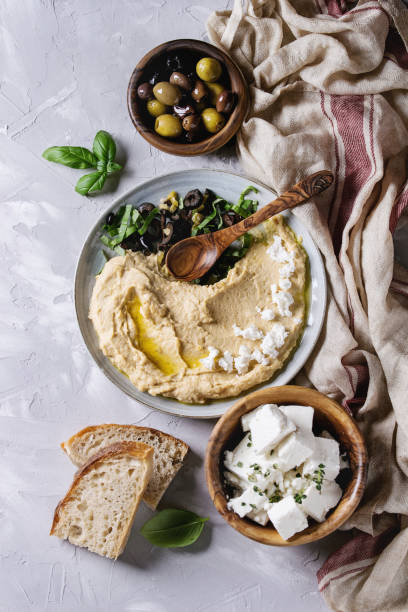 istock Hummus with olives and herbs 830429822
