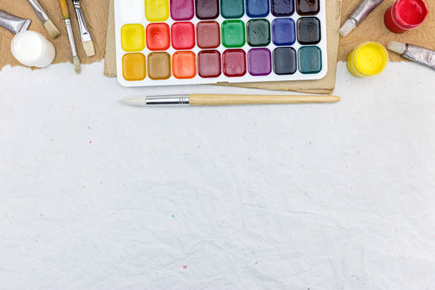 istock artistic or school supplies on gray paper background 830435620