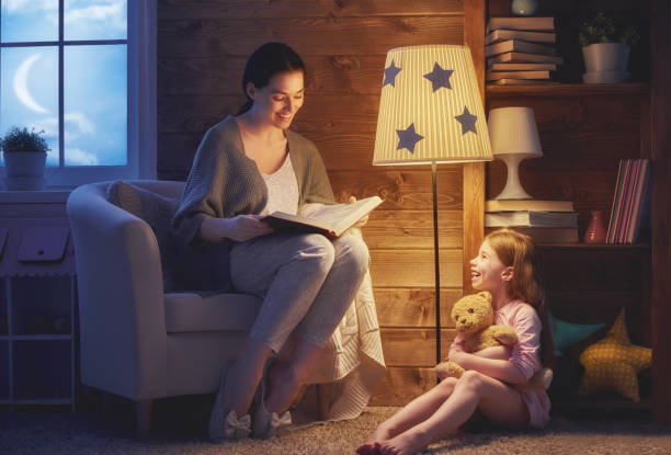istock Family reading bedtime. 830435648