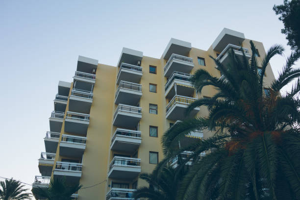 istock low angle view of modern apartment complex at spain 830474106