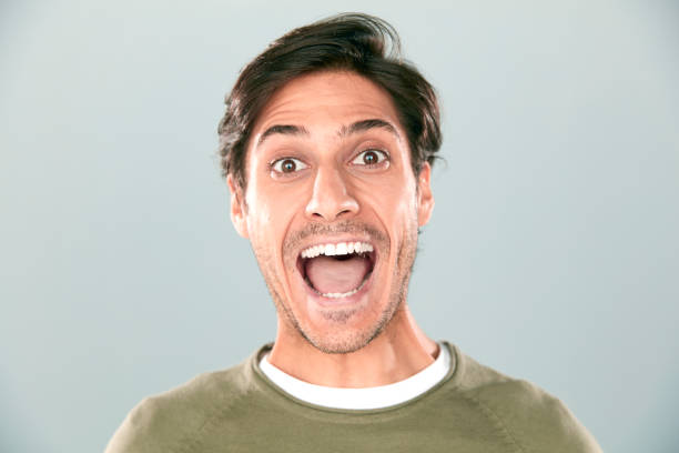 istock Portrait Of Surprised Young Man 830495488