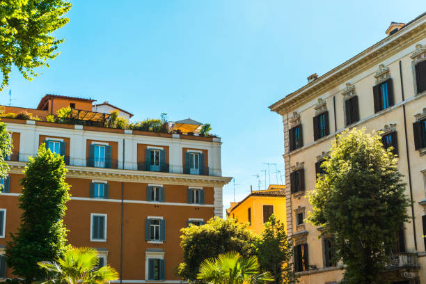 istock white and orange buildings with beautiful plants in the front 830501190