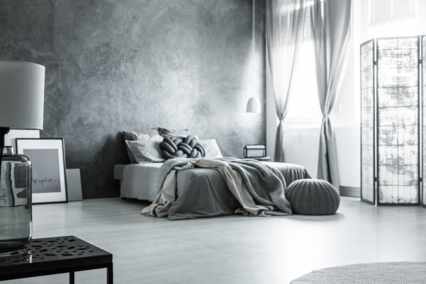 istock Scandinavian monochromatic gray bedroom design 830503872