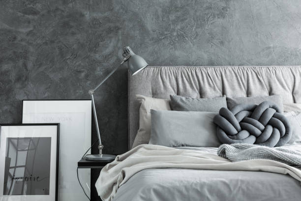 Close-up, bedroom with gray headboard